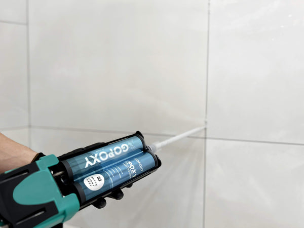 How does GoPoxy tile grout differ from cement-based grouts?